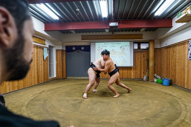 Authentic Sumo Experience in Tokyo: Enter the Sanctuary - Trying sumo movements with the wrestlers