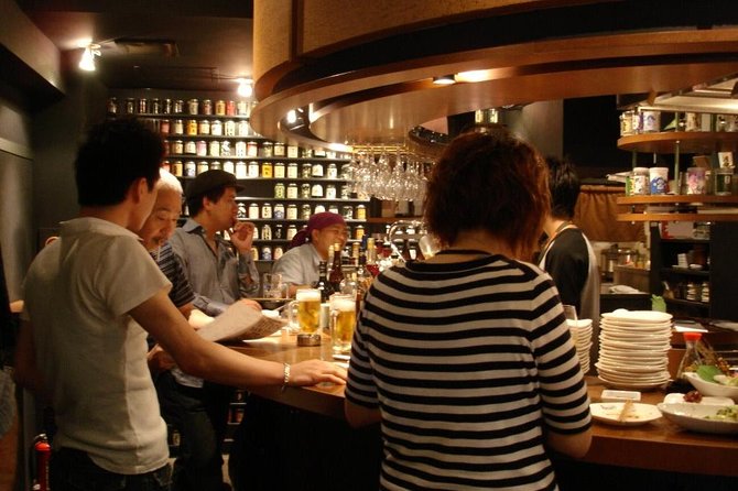 Ebisu Local Food Tour: Shibuya's Most Popular Neighborhood - Following the guide through Ebisu’s side streets