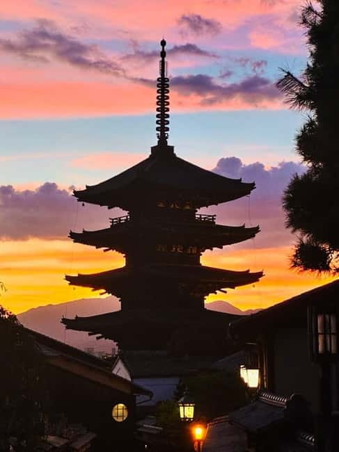 The five-storey Yasaka pagoda above Kyoto rooftops at sunset
