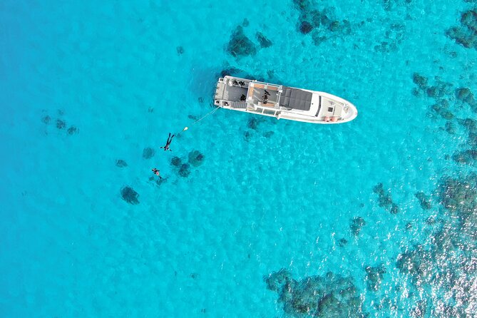 Naha: Full-Day Snorkeling Experience in the Kerama Islands, Okinawa - First snorkeling stop: settling into the clear water