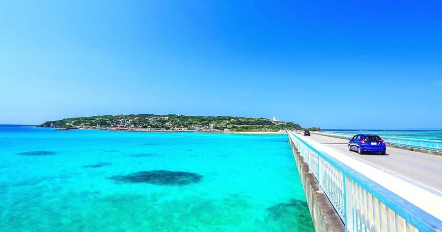 Okinawa Full Tour: Castle, Manza, Kouri, Aquarium & American - Nakagusuku Castle and stone walls above the coast