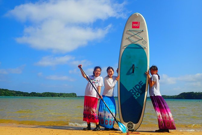 Okinawa Ishigaki Kabira Bay SUP or Canoe Tour - Getting onto the SUP or canoe