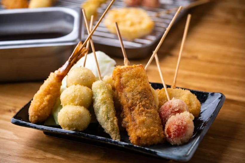 Osaka: Food Tour Kuromon Market & Dotonbori with Guide - A custard tart for the sweet finish
