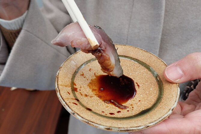 Osaka Food Tour with 10 Classic Japanese Tastings & Drinks - Fish, noodles, and the less expected bites