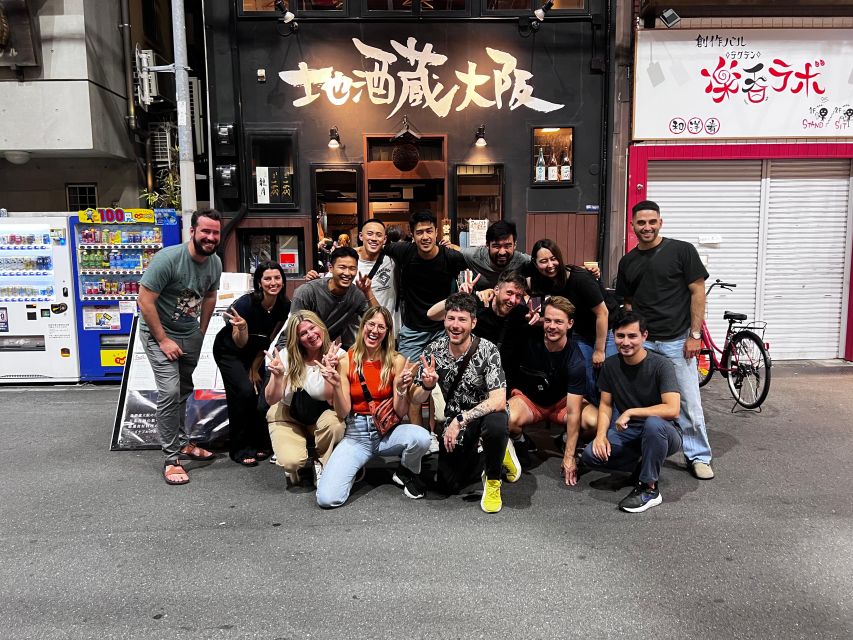 Osaka: Izakaya Bars Guided Walking Tour - The first izakaya: food, drinks, and hands-on takoyaki