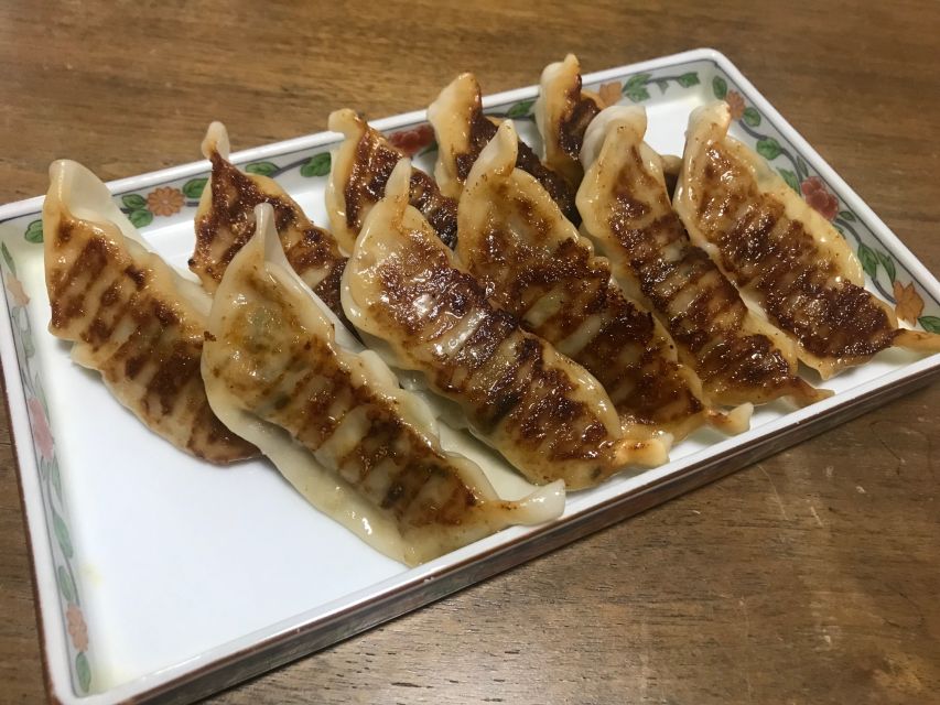 Osaka: Ramen and Gyoza Cooking Class in Dotonbori - Sitting down to eat your own ramen and gyoza