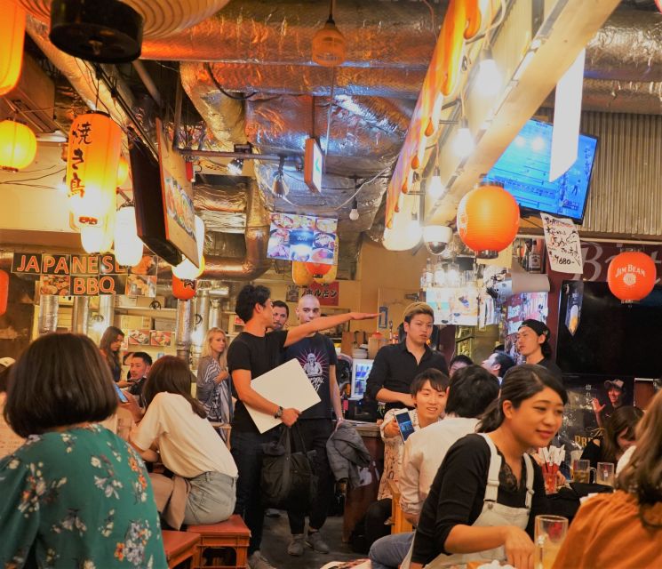 Shibuya Meltdown Night Tour: All-You-Can-Drink Bar Hopping - Meeting beneath the SHIBUYA TSUTAYA sign