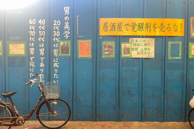 The Dark Side of Osaka Walking Tour - Tsutenkaku Hondori and the finish near the tower