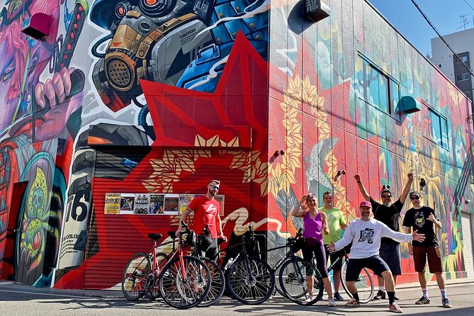 Urban Canvas: Osaka Street Art Bike Tour - Crossing the Yodo River toward Juso