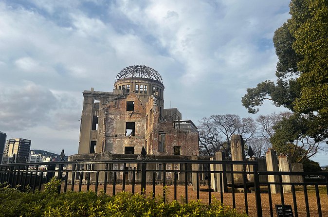Walking Through History: Hiroshima's Path to Peace - The cenotaph and the words Hiroshima asks you to remember